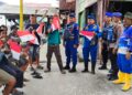 Semarak HUT RI ke-80, Ditpolairud Polda Kaltim Gelar Aksi Pembagian Bendera Merah Putih